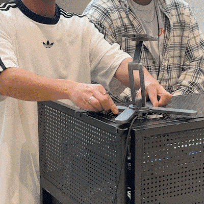 Model-X raising a laptop to eye level